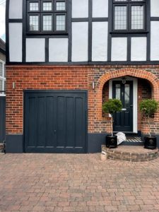 Image shows garage extension after the mismatched bricks that it was built with have been tinted with Total Wall Care brick tint.