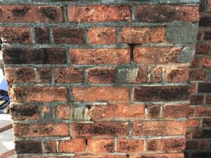 Damaged brick faces and loose pointing