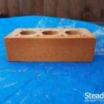 Buff brick with second coat of burnt orange brick tint