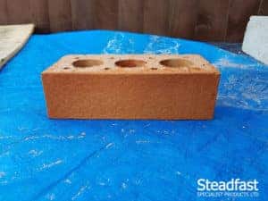 Buff brick with second coat of burnt orange brick tint