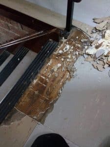Existing floor covering cracked and damaged