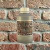 Bottle Smoke Grey Mortar Tint against brick wall