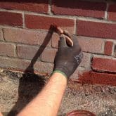 Image shows bricks being tinted red