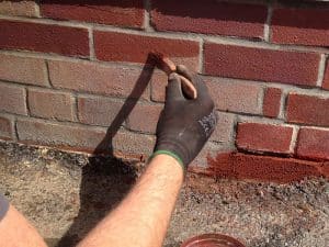 Image shows bricks being tinted red